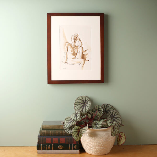 Ink figure drawing framed on wall